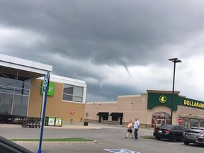 Two funnel clouds are visible in the sky on July 31, 2018, in this reader-submitted photo taken by Tecumseh resident Jamie Pepper in the parking lot of St. Clair Shores Shopping Centre.