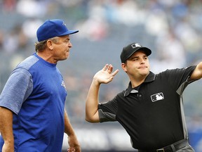 First base umpire Jansen Visconti throws Toronto Blue Jays manager John Gibbons out of the game against the New York Yankees Sunday, Aug. 19, 2018. (AP Photo/Noah K. Murray)