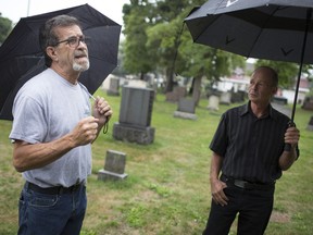 "In it for the long haul." Ed Shabsove, left, general manager of Windsor Memorial Gardens, and Eric Visser, of Elora Contracting Ltd., which rebuilt a stone arch at the Windsor Grove Cemetery, are seen there on Aug. 25, 2018.