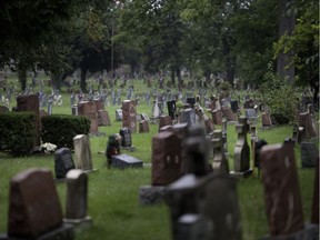 Gravestones at Windsor Grove Cemetery are seen on Aug. 25, 2018.