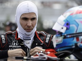 Robert Wickens prepares to qualify for Sunday's IndyCar series auto race, Saturday, Aug. 18, 2018, in Long Pond, Pa.