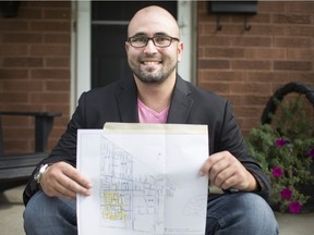 Greg Lemay, a candidate for Ward 8 councillor, is pictured with a map of his door-knocking route outside his home, Wednesday, August 9, 2018.