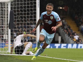 Burnley's Jeff Hendrick celebrates scoring his side's first goal of the game during their English Premier League soccer match against Fulham at Craven Cottage, London, Sunday, Aug. 26, 2018.