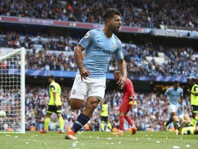 Manchester City's Sergio Aguero celebrates scoring his side's third goal of the game during the English Premier League soccer match between Manchester City and Huddersfield Town at the Etihad Stadium in Manchester, England, Sunday, Aug. 19, 2018.