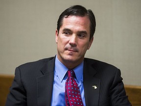 FILE - In this Nov. 15, 2017, file photo, Michigan Department of Health and Human Services Director Nick Lyon sits in court during his preliminary examination in Genesee County District Court in Flint, Mich. A judge decides Monday, Aug. 20, 2018, if Michigan's health director will face trial on manslaughter charges for the deaths of two men during a Legionnaires' disease outbreak during the Flint water crisis.