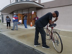 Daniel Sturgis pauses outside New Bethel Baptist Church in Detroit, Thursday, Aug. 16, 2018. Aretha Franklin, the undisputed "Queen of Soul" who sang with matchless style on such classics as "Think," ''I Say a Little Prayer" and her signature song, "Respect," and stood as a cultural icon around the globe, died Thursday at age 76 from pancreatic cancer. C.L. Franklin, her father, had been pastor at the church that Franklin learned the gospel fundamentals that would make her a soul institution.