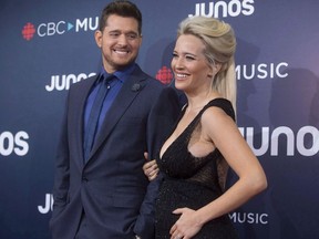 Michael Buble and wife Luisana Lopilato arrive on the red carpet at the Juno Awards in Vancouver, Sunday, March, 25, 2018.