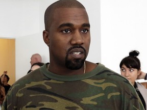 FILE - In this Sept. 10, 2015 file photo, Kanye West appears at the Brother Vellies Spring 2016 collection presentation during Fashion Week, in New York. West was silent when it comes to whether he thinks President Donald Trump cares for black people. West appeared on ABC's "Jimmy Kimmel Live" on Thursday, Aug. 10, 2018. West discussed his support for Trump and questioned why people go after the president instead of trying "love." However, West did not answer when Kimmel asked if the rapper thought Trump cares about black people, or any people at all.