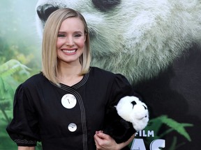FILE - In this March 17, 2018 file photo, Kristen Bell holds a stuffed panda teddy bear at the LA Premiere of "Pandas" in Los Angeles. Bell narrates the documentary which will be in wide release beginning Friday.