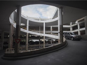 A vehicle drives down the spiral exit in the Goyeau Street parking garage, pictured on Aug. 29, 2018.