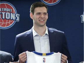 News Detroit Pistons players Ish Smith (14) and Jon Leuer (30) stand with Detroit Pistons President of Basketball Operations & Head Coach Stan Van Gundy, right, and General Manager Jeff Bower after being introduced to the media, Friday, July 8, 2016 in Auburn Hills, Mich.