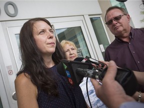 Lisa Grehan, daughter of Larry and Patricia Best, a couple killed by an impaired driver while they were riding their motorcycle, is joined by Ken Best, Larry's brother, and Betty Best, Larry's mother, as she speaks to the media outside the Ontario Court of Justice, Thursday, Aug. 30, 2018, after the sentencing of Gerald Decoste.