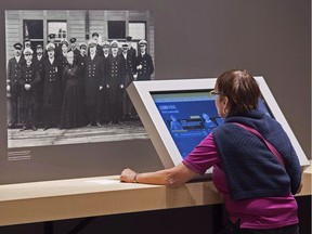 A visitor views an exhibit at the Canadian Museum of Immigration at Pier 21 in Halifax on June 25, 2015. The facility was renovated as part of a $30-million expansion that celebrates Canada's era of immigration with an emphasis on the period from 1928 to 1971.