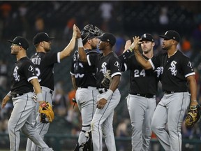 Chicago White Sox players celebrate their 6-3 win against the Detroit Tigers after a baseball game in Detroit, Tuesday, Aug. 14, 2018.