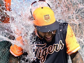 Detroit Tigers' Ronny Rodriguez is doused  following a 7-2 victory against the Chicago White Sox on Aug. 23, 2018, in Detroit.