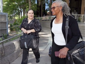 In this June 4, 2018, file photo, taken during her fraud trial, Angela Berry, left, leaves the Superior Court of Justice building in Windsor with her lawyer Linda McCurdy.