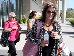 Windsor Police Staff Sgt. Christine Bissonnette, right, leaves Human Rights Tribunal of Ontario at Windsor City Hall with her mother Jacqueline Bissonnette, left, and her sister Trisha Sylvestre September 5, 2018.