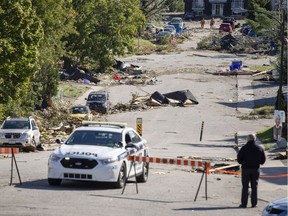 An Gatineau Police car is stationed at the corner of Rue Jumonville and Rue Charles-Albanel, in the Mont-Bleu community in Gatineau, which is in clean-up mode Saturday, September 22, 2018 after a tornado touched down late Friday.