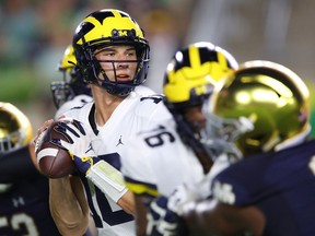 Dylan McCaffrey of the Michigan Wolverines throws a second half pass while playing the Notre Dame Fighting Irish at Notre Dame Stadium on September 1, 2018 in South Bend, Indiana. Notre Dame won the game 24-17.