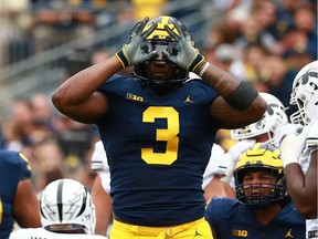 Rashan Gary of the Michigan Wolverines reacts to a sack against the Western Michigan Broncos at Michigan Stadium on Sept. 8, 2018 in Ann Arbor, Michigan.