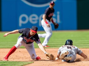 Second baseman Adam Rosales of the Cleveland Indians drops the throw as Mikie Mahtook of the Detroit Tigers steals second fifth inning at Progressive Field on Sept. 16, 2018 in Cleveland, Ohio.