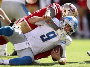 Matthew Stafford of the Detroit Lions is sacked by Cassius Marsh of the San Francisco 49ers at Levi's Stadium on Sept. 16, 2018 in Santa Clara, California.