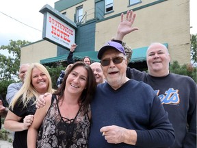 Southwood Hotel co-owner Walt Hoffman, front right, poses with hotel manager Lisa Gionet, front left, other staff and longtime patrons during a farewell party Sept. 22, 2018. The sale of the Wellington Avenue establishment, owned by members of the Bielich family since 1944, is imminent, says Hoffman.