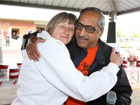 Guest speaker Shiva Koushik, right, is embraced by event organizer Erma Roung during Sunday's Multiple Myeloma March and fundraiser at Vollmer Recreation Complex September 30, 2018.