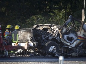 The charred remains of a transport truck on the WB lanes of 401 west of Orford Rd., is seen on Sept. 12, 2018.