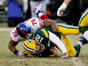 Romeo Okwara of the New York Giants sacks Aaron Rodgers of the Green Bay Packers in the second quarter during the NFC Wild Card game at Lambeau Field on January 8, 2017 in Green Bay, Wisconsin.