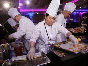 Jamie Chu from Legends prepares sliders at the annual Battle of the Hors D'oeuvres at Caesars Windsor in Windsor on May 21, 2015.