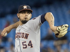 Houston Astros pitcher Roberto Osuna pitches in the ninth inning against the Toronto Blue Jays in their American League MLB baseball game in Toronto on Sept. 24, 2018.