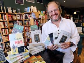 Daniel Wells, owner of Biblioasis Press is shown with some of the store's latest titles on Wednesday, September 26, 2018.