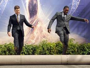 Colin Jost, left, and Michael Che, co-hosts for the 70th Emmy Awards, roll out the gold carpet outside the Microsoft Theatre, Thursday, Sept. 13, 2018, in Los Angeles. The awards will be held on Monday.