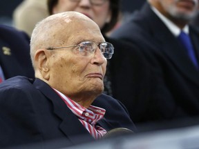 FILE - In this Oct. 19, 2016, file photo, former U.S. Rep. John Dingell, D-Mich., listens to Democratic vice presidential candidate Sen. Tim Kaine, D-Va. speak during a campaign stop in Detroit. Dingell is in a Detroit-area hospital after suffering a heart attack early Monday, Sept. 17, 2018.