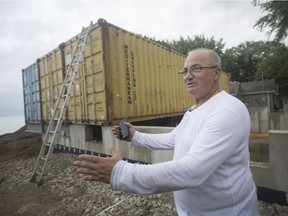 Sandor Abri oversees the placement of large shipping containers that he will use to construct his home on St. Clair Rd. in Stoney Point, Tuesday, Sept. 25, 2018.