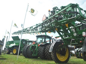 Modern-day farm equipment, such as these John Deer machines on display at the International Plowing Match & Rural Expo in Chatham-Kent, can exceed $500,000. Urban-based visitors to the event this week might be surprised with the cost of modern farm equipment. Tom Morrison/Chatham This Week