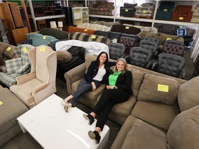 Habitat for Humanity Windsor-Essex received $75,000 seed grant from the Ontario Trillium Foundation on Friday to help bring back the furniture bank for needy individuals. Windsor West MPP Lisa Gretzky, left, and Habitat executive director Fiona Coughlin pose among the organization's collection of furniture at their ReStore outlet after the media conference.