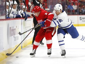 The Detroit Red Wings signed defenceman Joe Hicketts, seen in action on left against Toronto Maple Leafs winger Trevor Moore last season, to a new two-year deal on Wednesday.