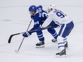 Toronto Maple Leafs forwards John Tavares, right ties up the stick of teammate Auston Matthews during a scrimmage game on the opening day of Leafs training camp in Niagara Falls on Sept. 14, 2018.