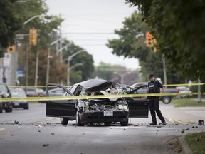 Windsor police collision reconstruction specialists examine the scene of a serious two-vehicle collision at Howard Avenue and Ellis Street East on the morning of Sept. 24, 2018.