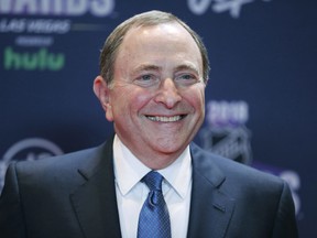 FILE - In this June 20, 2018, file photo, Gary Bettman, commissioner of the National Hockey League, poses on the red carpet before the NHL Awards in Las Vegas. Bettman was selected to the Hockey Hall of Fame. The NHL and NHL Players' Association can each vote in September 2019 to terminate the current collective bargaining agreement and set the clock ticking toward another work stoppage. With a year left until that key decision time, issues like escrow payments and the Olympics are moving to the forefront.