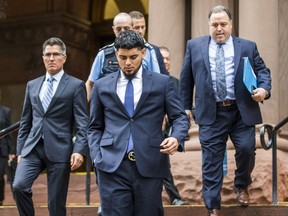 Former Blue Jays pitcher Roberto Osuna leaves the courthouse at Old City Hall in Toronto on Sept. 25, 2018. An assault charge against Osuna has been withdrawn in exchange for a one-year peace bond. The 23-year-old was charged in May with assault in an alleged domestic incident.