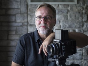 WINDSOR, ONT:. SEPT 4, 2018 -- Mike Kovaliv, a local portrait photographer, is pictured with his Mamiya RZ67 camera in his studio, Tuesday, Sept. 4, 2018.  Kovaliv used the medium format camera to photograph 21 women (20 portraits) for his upcoming exhibit, Women of Windsor, that is opening Sept. 12 at the Art Gallery of Windsor.