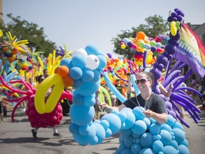 In this Aug. 12, 2018, file photo, the annual Windsor-Essex Pride Festival parade makes its way down Ottawa Street. A local Catholic school board trustee candidate is being criticized for disparaging social media comments directed at the LGBT community.