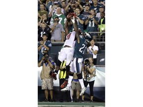Atlanta Falcons' Julio Jones, left, cannot catch a pass in the end zone next to Philadelphia Eagles' Ronald Darby during the final second of an NFL football game early Friday, Sept. 7, 2018, in Philadelphia. Philadelphia won 18-12.