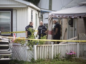 Windsor police investigate after a man was shot by Windsor police officers responding to a man with a gun at the Countryside Village trailer park off Division Rd., Sunday evening.