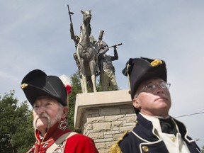 David May, left, and Dale Kidd, from the provincial marine Amherstburg reenactment group are pictured at the unveiling of the Sir Isaac Brock and Chief Tecumseh statue in Olde Sandwich Town on Sept. 7, 2018.