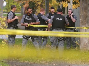 In this Nov. 2, 2016, file photo, Windsor police officers are shown at the scene of a "major crime incident" outside a home in the 900 block of Curry Avenue.