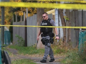 In this Nov. 2, 2016, file photo, a Windsor police officer is shown at the scene of a "major crime incident" outside a duplex in the 900 block of Curry Avenue.